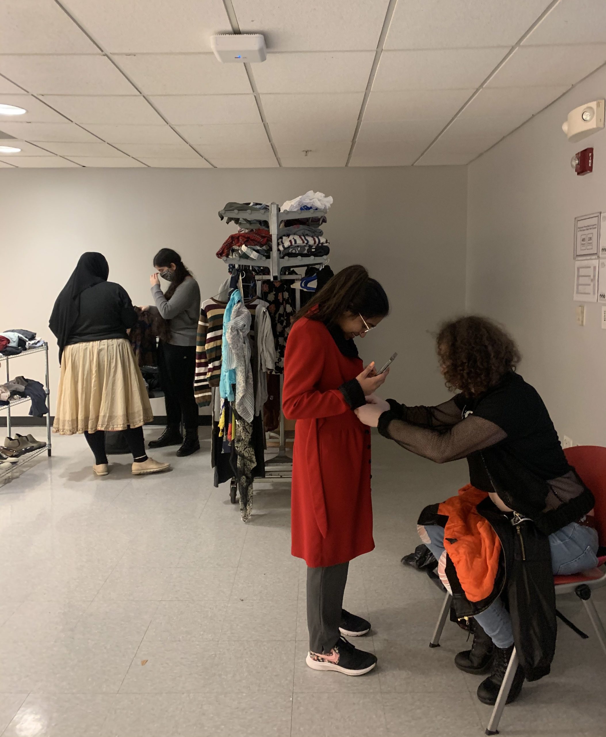 Participants try on clothing at NJIT's swap
