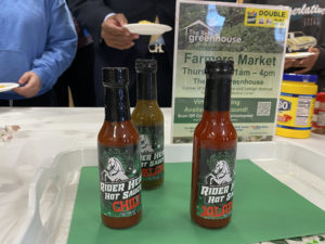 Three bottles of sauce labled "hot sauce"