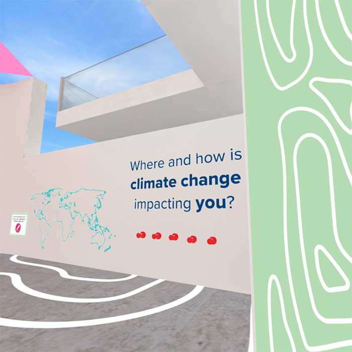 Lifelike computer image of white building walls in an open-air space, with one wall having a world map and text: "Where and how is climate change impacting you?"
